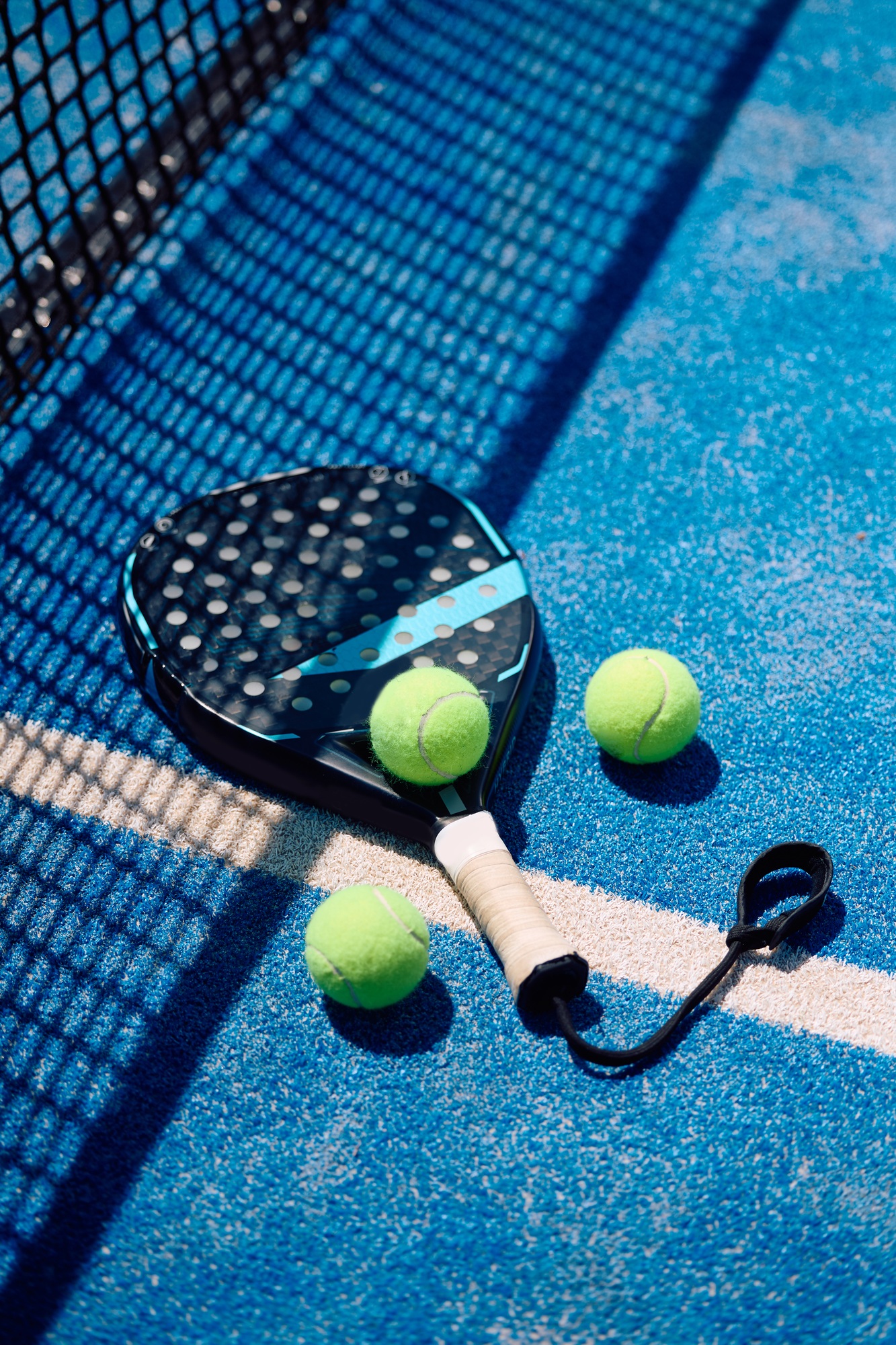 Paddle tennis equipment on the court.